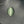 Green cat's eye gemstone on a dark fabric background